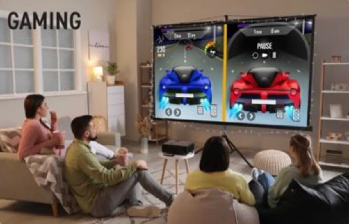 Friends playing a split-screen racing game on a 120-inch screen projected by the Aureon AZ8600 in a bright living room